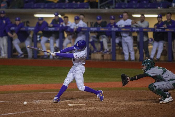 LSU senior outfielder Antoine Duplantis (8) hits the ball during the Tigers' 6-5 victory over Southeastern on Tuesday, Feb. 19, 2019, in Alex Box Stadium.