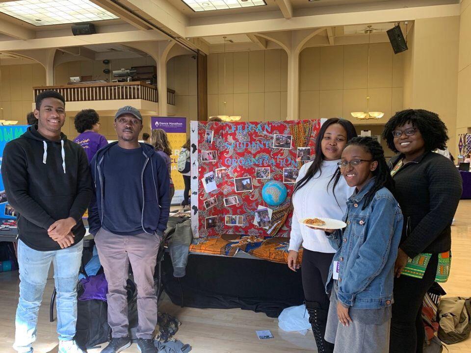 (Left to Right) Afolabi Ige, Gilles Numkam, Dilichi Ejim, Jasmine Munga and Glory Ogunyinka stand at the African Student Organization table at the Spring 2019 Involvement Fair.