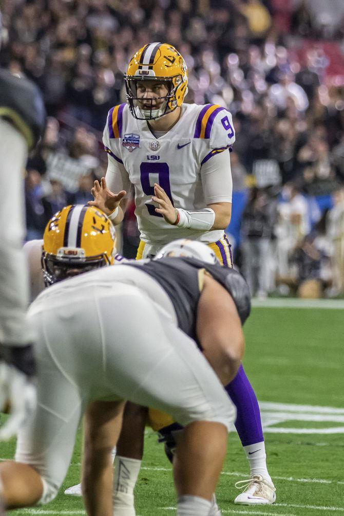 LSU junior quarterback Joe Burrow (9) prepares for a snap during the Tigers' 40-32 victory over UCF on Tuesday, Jan. 1, 2019, in State Farm Stadium.