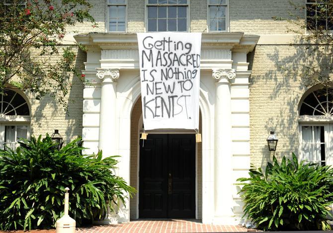 A sign outside the DKE fraternity house on Saturday reads "Getting massacred is nothing new to Kent St."&#160;