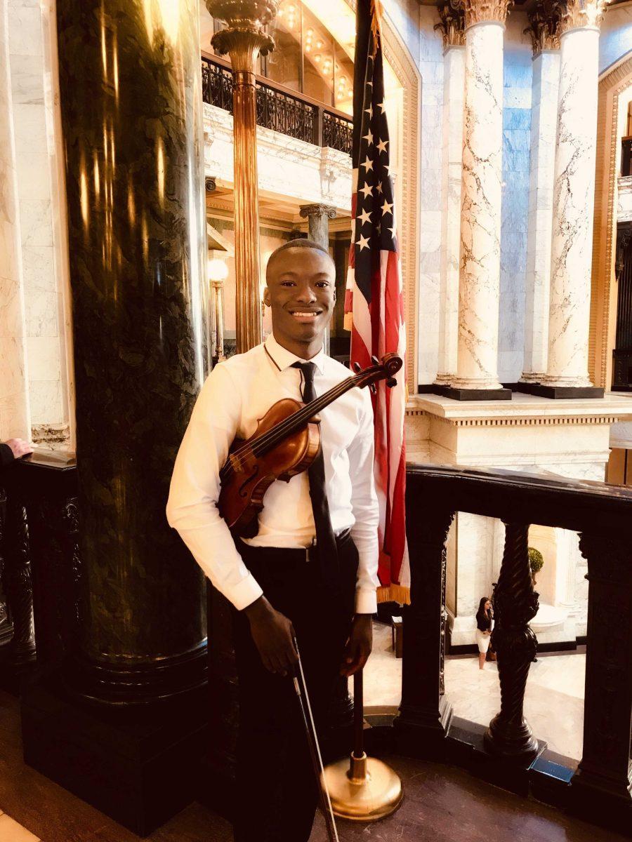 College of Music graduate student John Uzodinma stands in the Mississippi House of Representatives before performing the national anthem.