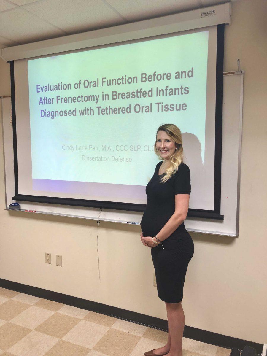 Cindy Parr defends her dissertation while pregnant.