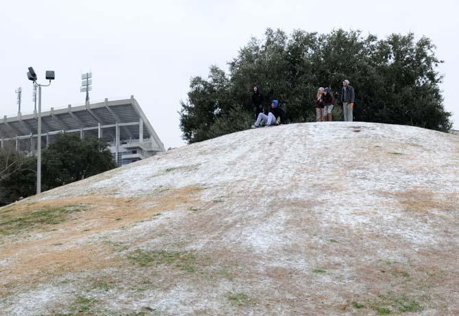 Students sled down the Indian Mounds on Tuesday, Jan. 28, 2014 on campus.