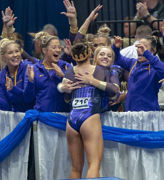 LSU gymnastics celebrate during the Tigers' victory in the Baton Rouge Regional on Saturday, April 6, 2019 in the PMAC.