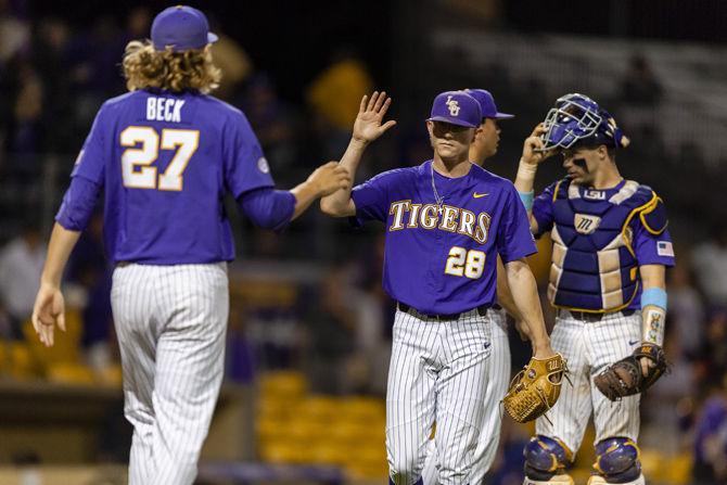 LSU baseball players celebrate during the Tigers' 5-3 victory over Lamar on Tuesday, April 23, 2019, in Alex Box Stadium.