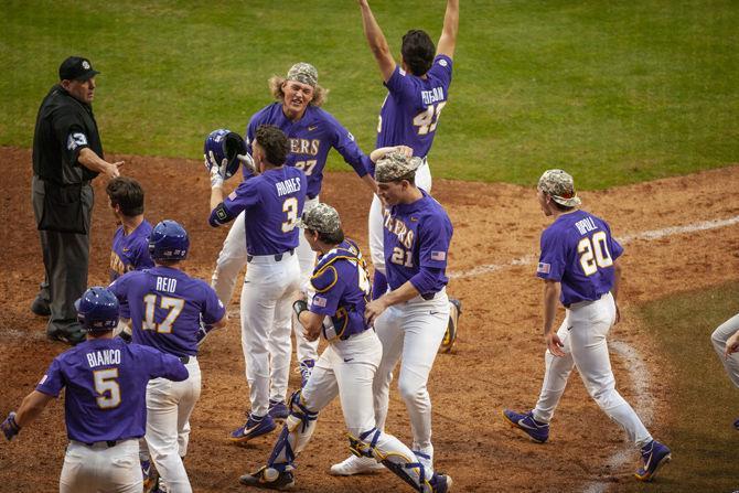 LSU baseball players celebrate after the Tigers' 6-5 victory over Army on Saturday, Feb. 16, 2019, in Alex Box Stadium.