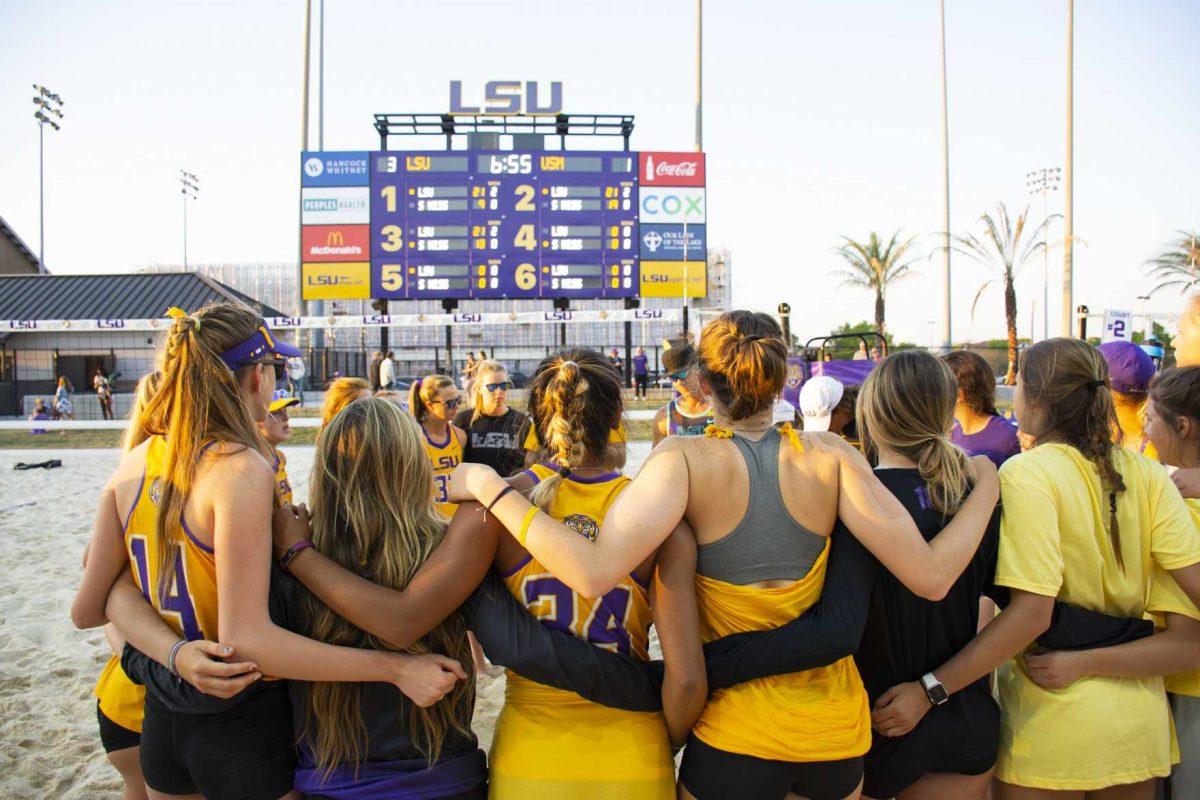 <p>The LSU Beach Volleyball Team huddles together for a team meeting at the end of their match against USM at the LSU Beach Volleyball Stadium on Saturday, March 23, 2019.</p>