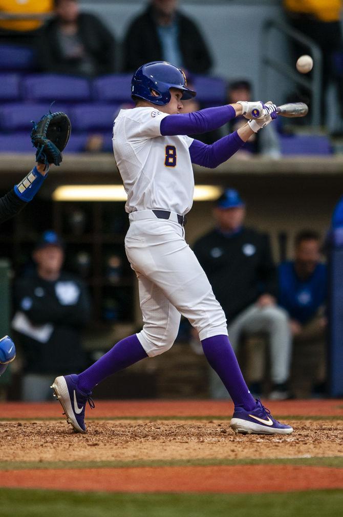 LSU senior right fielder Antoine Duplantis (8) hits the ball during the Tigers' 2-1 victory over Kentucky on Saturday, March 16, 2019, in Alex Box Stadium.