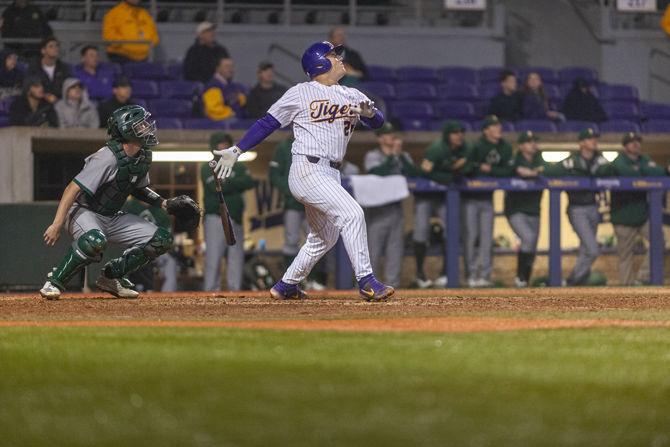 LSU freshman first basemen Cade Beloso (24) hits the ball during the Tigers' 6-5 victory over Southeastern on Tuesday, Feb. 19, 2019, in Alex Box Stadium.