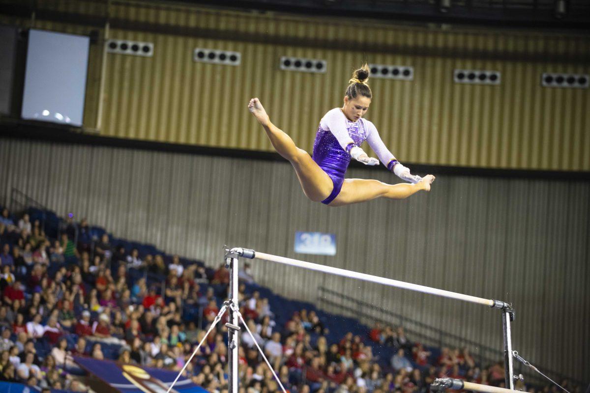 LSU all-around senior Sarah Finnegan completes the bars during the Tigers&#8217; 197.5125 first round success at 2019 NCAA Women&#8217;s Gymnastics Championship Semifinals meet on Friday, April 19, 2019, in the Fort Worth Convention Center.