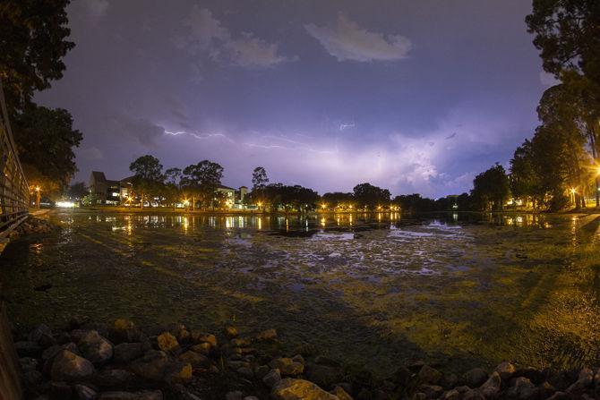 Lightning flashes over the University Lake on Wedsnday, Sept. 19, 2018.