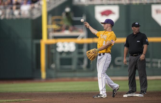 LSU junior infielder Alex Bregman (8) passes the ball during the Tigers' 8-4 final defeat against TCU in the NCAA Men's College World Series on Thursday, June 18, 2015 at the TD Ameritrade Park in Omaha.