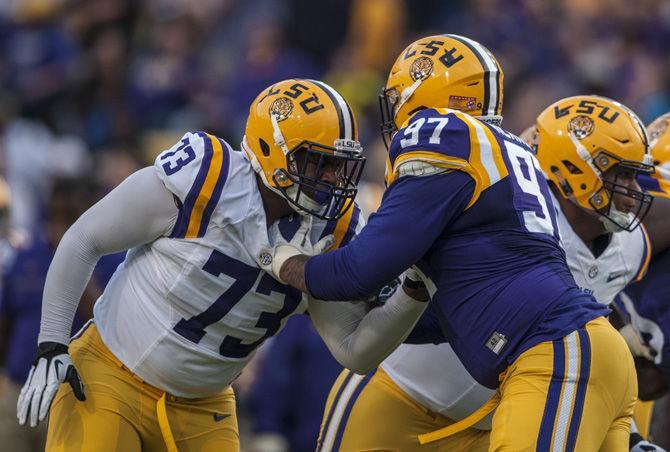 LSU sophomore offensive tackle Adrian Magee (73) tries to block senior defensive end Frank Herron during the Tigers' Spring Game at Tiger Stadium on April 22, 2017.