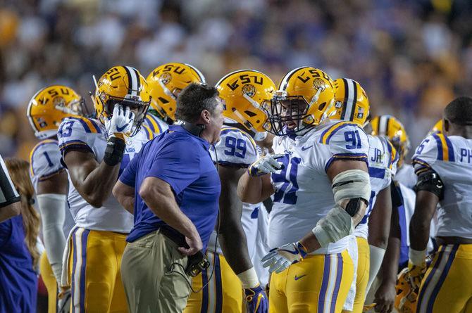 LSU head coach Ed Orgeron talks to LSU junior defensive end Breiden Fehoko (91) during the Tigers&#8217; 29-0 loss against Alabama on Saturday, Nov. 3, 2018, in Tiger Stadium.