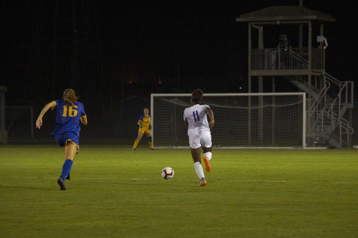 LSU junior forward Tinaya Alexander (11) sprints foward with the ball on Friday, Aug. 30, 2019 during the Tigers' 1-0 victory against McNeese in the LSU Soccer Stadium.