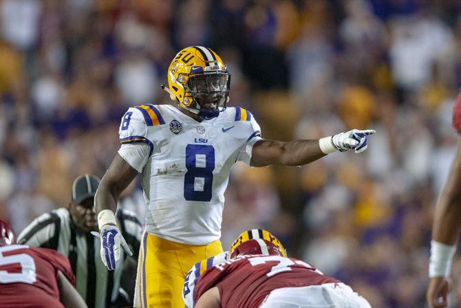 LSU sophomore linebacker Patrick Queen (8) directs during the Tigers&#8217; 29-0 loss against Alabama on Saturday, Nov. 3, 2018, in Tiger Stadium.