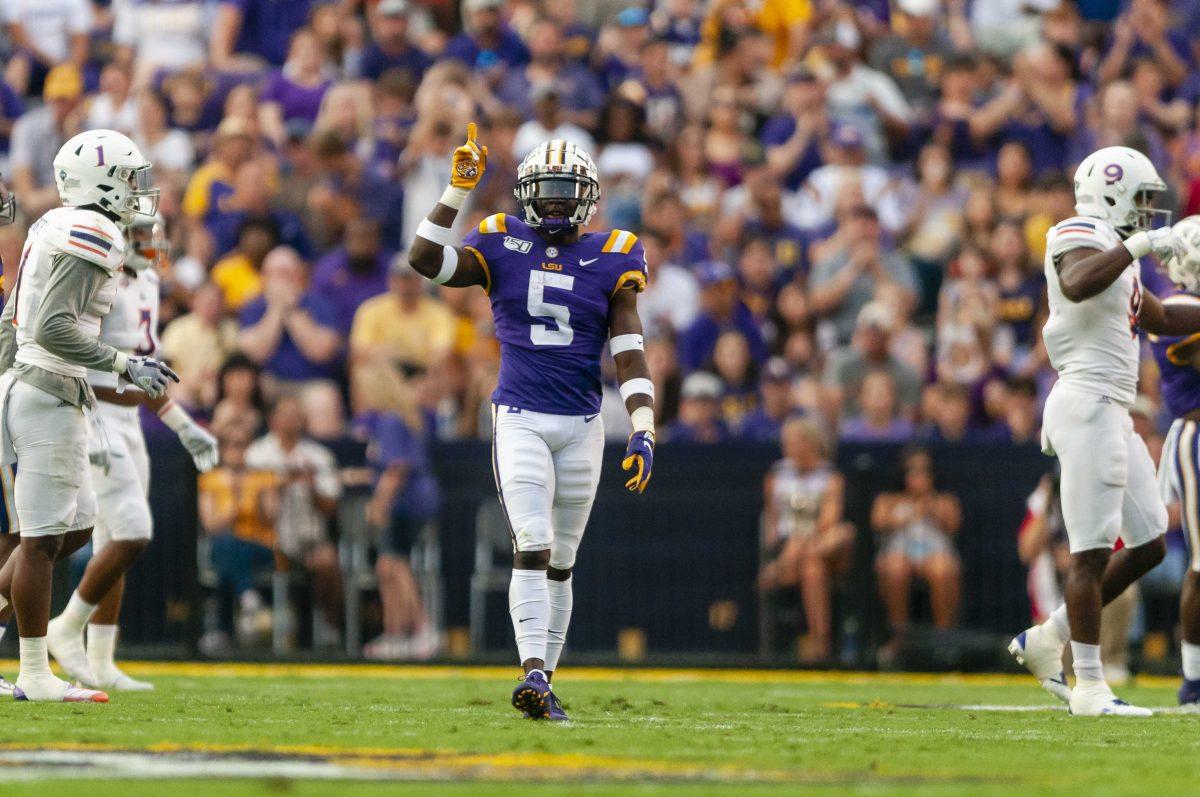 LSU junior cornerback Kary Vincent Jr. (05) celebrates after making a stop during the Tigers' game against Northwestern State on Saturday, Sept. 14, 2019.