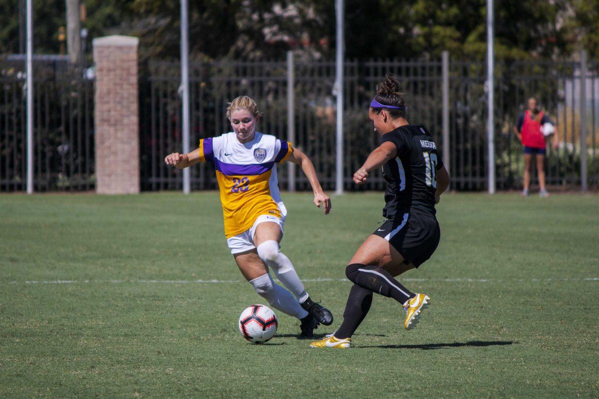 LSU freshman midfielder Maddie Moreau (23) and JMU senior forward Claire Meiser (10) battle for the ball on Sunday, Sept. 22, 2019, during the Tigers' 1-0 loss against JMU at the LSU Soccer Complex.