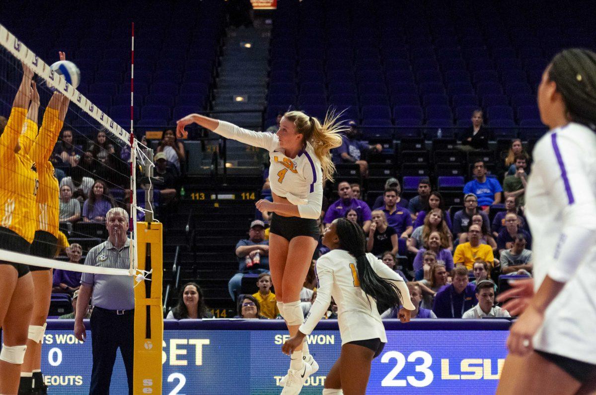 LSU sophomore middle blocker Whitney Foreman (4) spikes the ball during the Lady Tigers' 3-0 victory over Southern Miss on Friday, Sept. 20, 2019, in the PMAC.