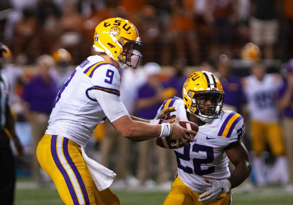 LSU senior quarterback Joe Burrow (9) hands LSU junior running back Clyde Edwards-Helaire (22) the ball during the Tigers' 45-38 victory over Texas on Saturday, Sept. 7, 2019, at Darrell K Royal &#8211; Texas Memorial Stadium.