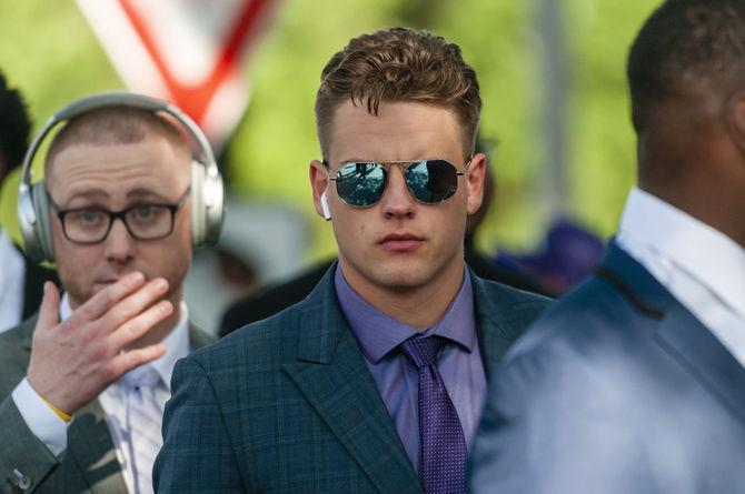 LSU senior quarterback Joe Burrow (9) walks down Victory Hill on Saturday, Aug. 31, 2019.