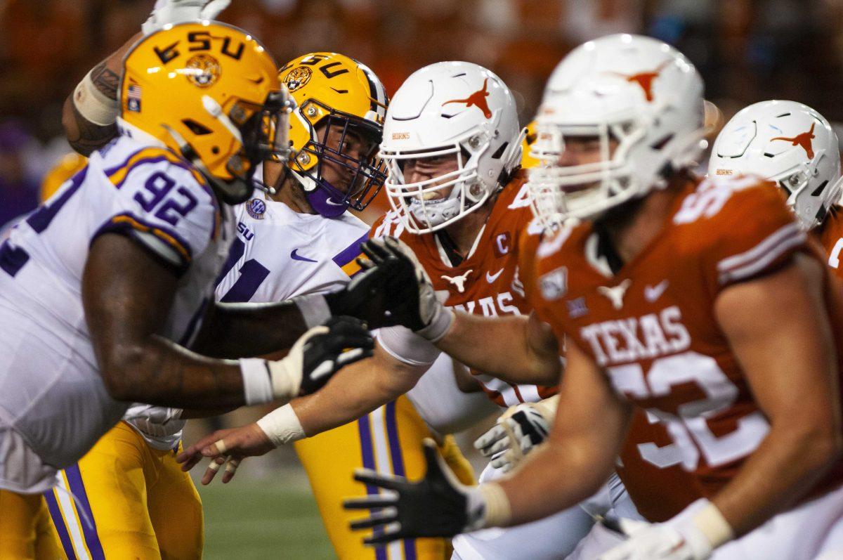 LSU junior defensive end Neil Farrell Jr. (92) and senior defensive end Breiden Fehoko (91) rush the passer during the Tigers' 45-38 victory over Texas on Saturday, Sept. 7, 2019, at Darrell K Royal &#8211; Texas Memorial Stadium.