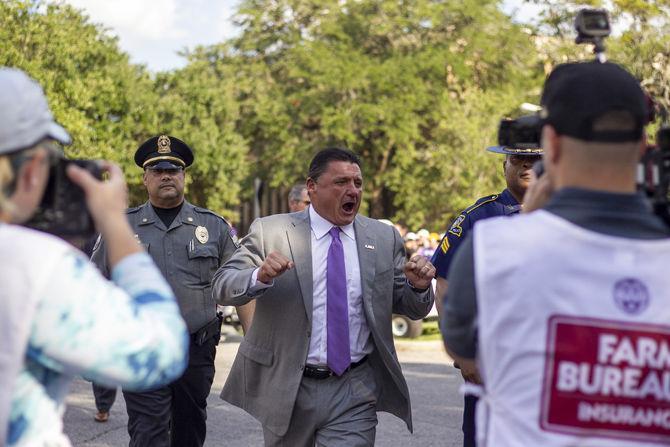 LSU football coach Ed Orgeron walks down Victory Hill on Saturday, Aug. 31, 2019.