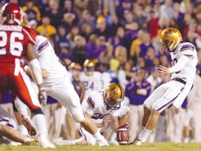 LSU junior place kicker Josh Jasper kicks the game-tying 41-yard field goal to send the game into overtime. Jasper kicked a 36 yarder in overtime to beat Arkansas, 33-30, on Saturday night in Tiger Stadium.