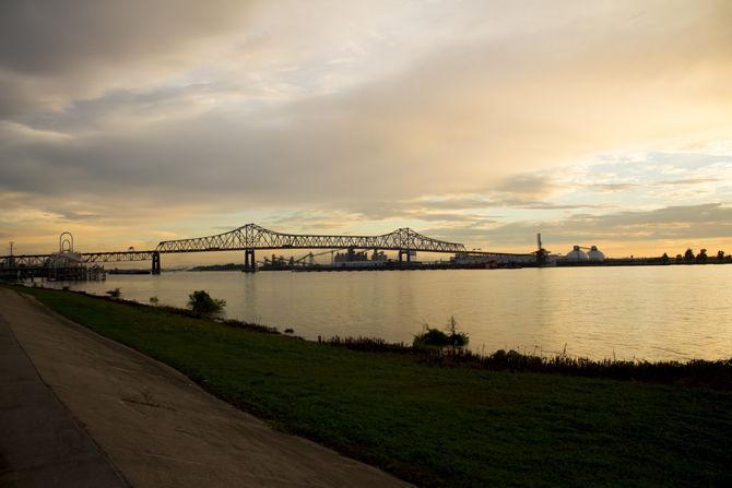 The Mississippi River runs through downtown Baton Rouge on the evening of Sunday, Sept. 23, 2018. The Horace Wilkinson bridge can be seen crossing the bridge in the distance.