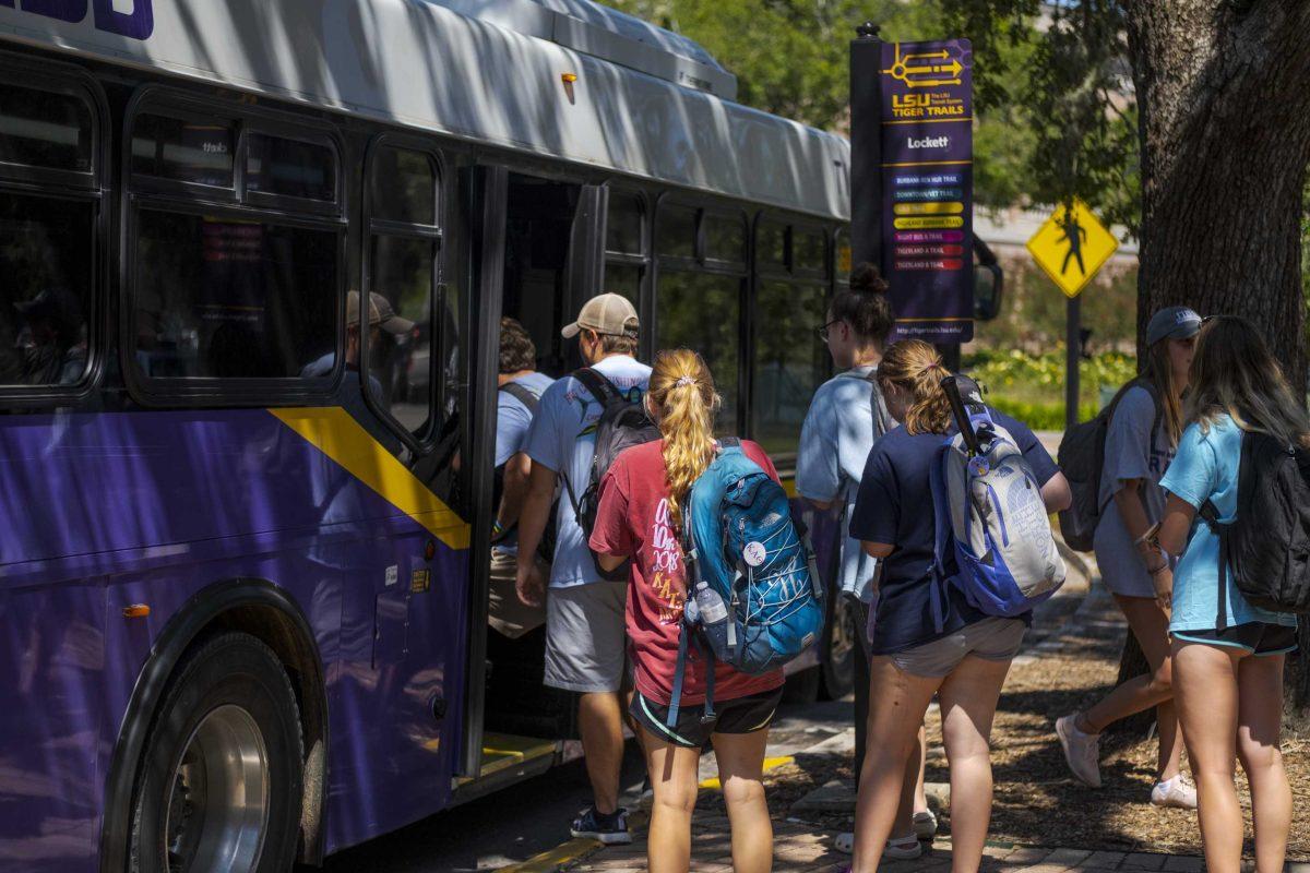 A group of LSU students step onto an LSU Tiger Trails bus at Lockett Hall on Wednesday, Sept. 4, 2019.