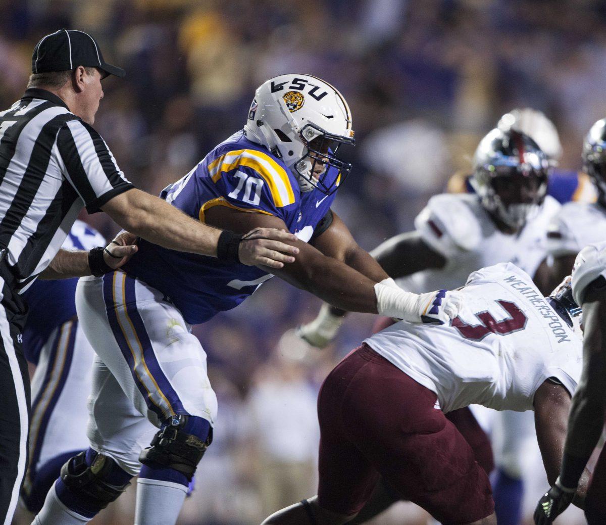 LSU freshman offensive lineman Ed Ingram (70) blocks Troy senior safety Kris Weatherspoon (3) during the Tigers' 24-21 loss against Troy in Tiger Stadium on Saturday, Sept. 30, 2017.