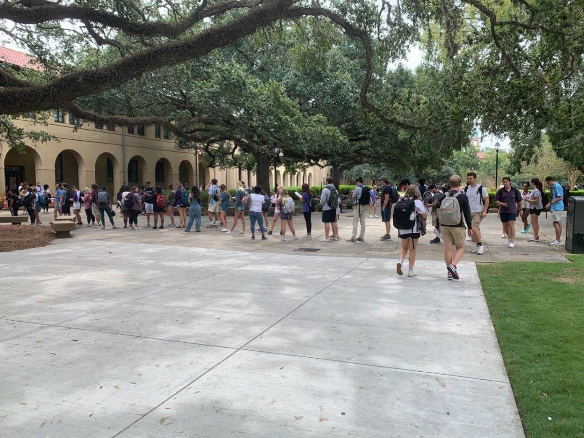 LSU students wait in a line that stretches to the Quad to enter the LSU Testing Center in Himes Hall on Sept. 19.