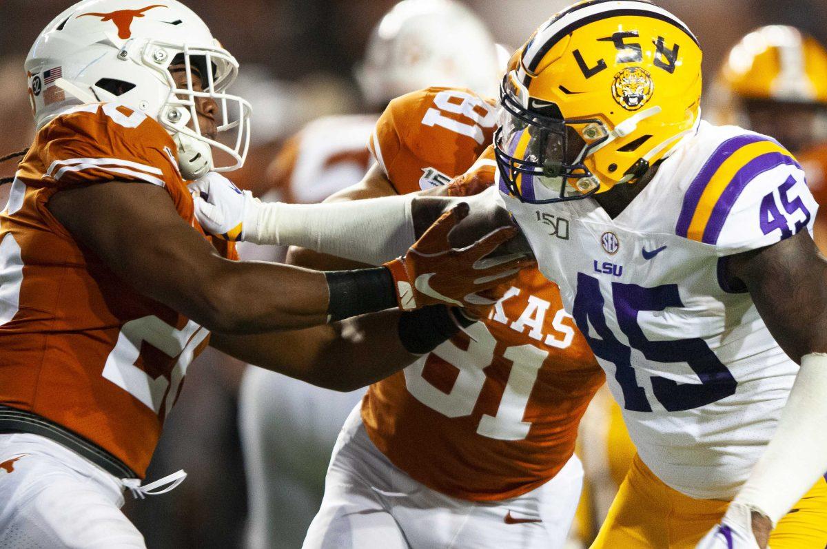 LSU senior outside linebacker Michael Divinity Jr. (45) leans in to block during the Tigers' 45-38 victory over Texas on Saturday, Sept. 7, 2019, at Darrell K Royal &#8211; Texas Memorial Stadium.