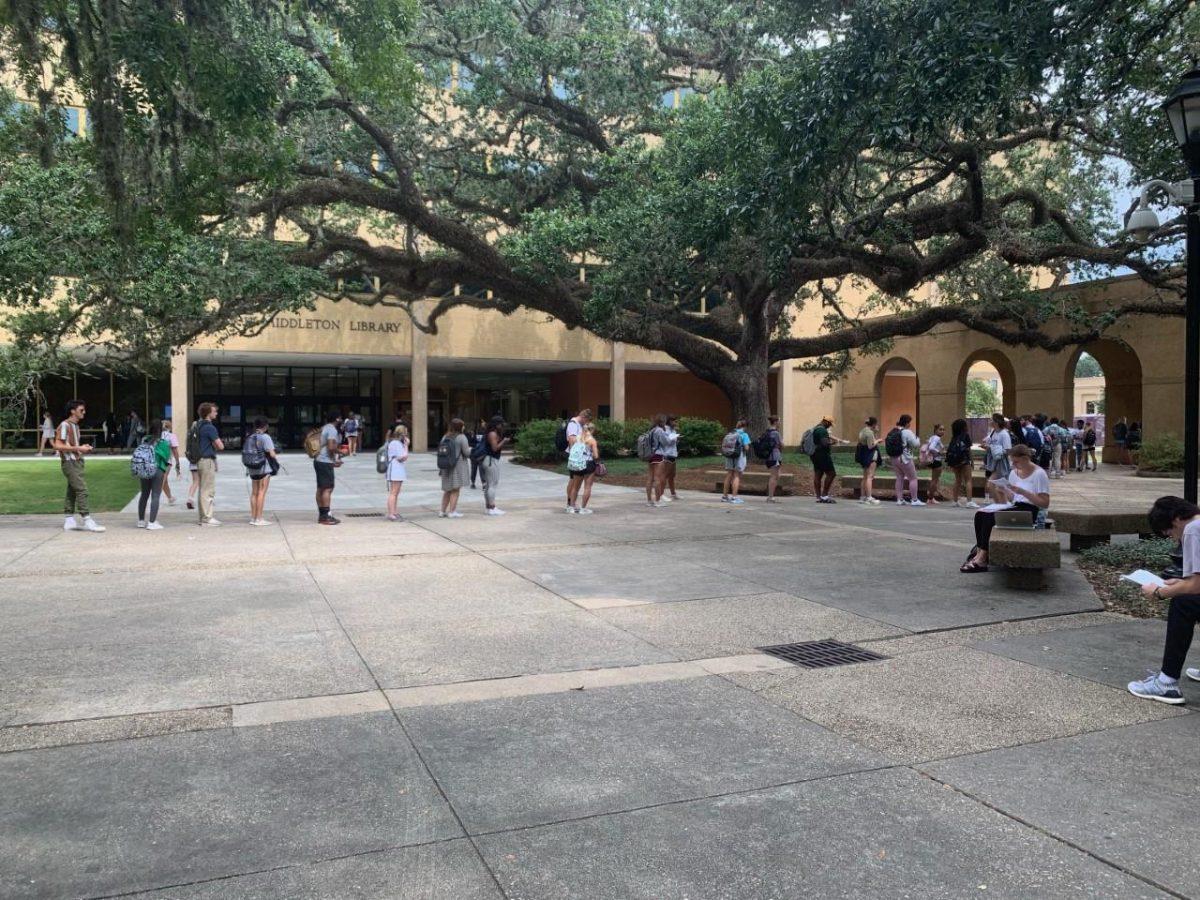 LSU students wait in a line that stretches to the Quad to enter the LSU Testing Center in Himes Hall on Sept. 19.