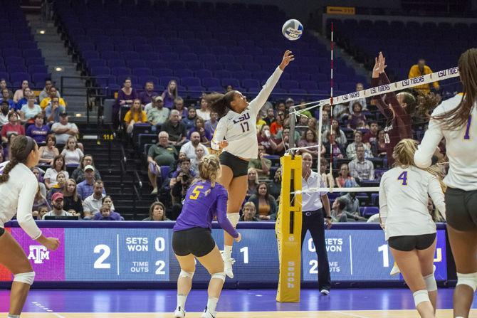 LSU junior outside hitter Milan Stokes (17) hits the ball over the net during the Lady Tigers&#8217; 2-3 loss against Texas A&amp;M in the PMAC on Sunday Sept. 30, 2018.