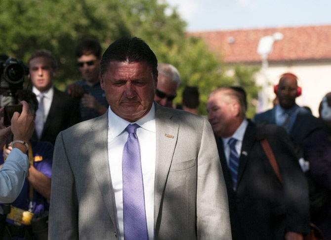 LSU football coach Ed Orgeron walks down Victory Hill on Saturday, Aug. 31, 2019.