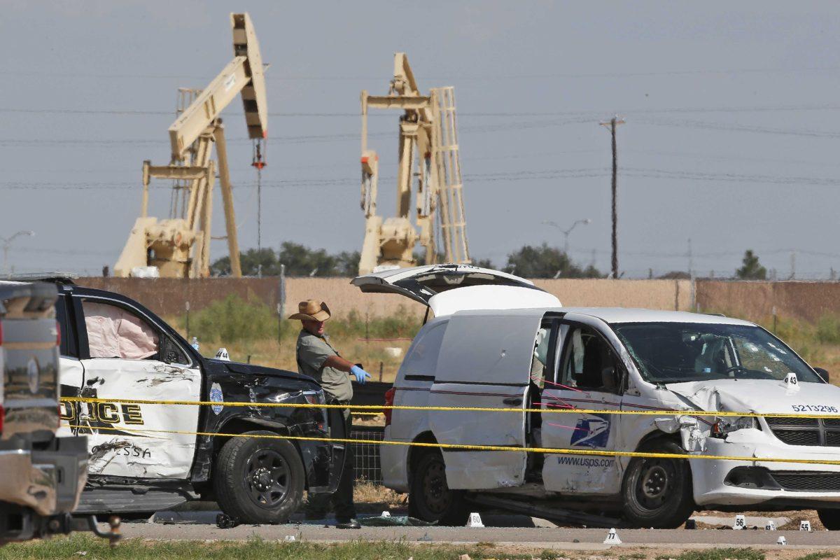 In this Sunday, Sept. 1, 2019, file photo, law enforcement officials process the crime scene from Saturday's shooting which ended with the shooter, Seth Ator, being shot dead by police in a stolen mail van, right, in Odessa, Texas. The mass shooting in West Texas spread terror over more than 10 miles (16 kilometers) as Ator, fired from behind the wheel of a car. Ator zigzagged through Midland and Odessa, two closely intertwined cities now brought closer by tragedy. (AP Photo/Sue Ogrocki, File)