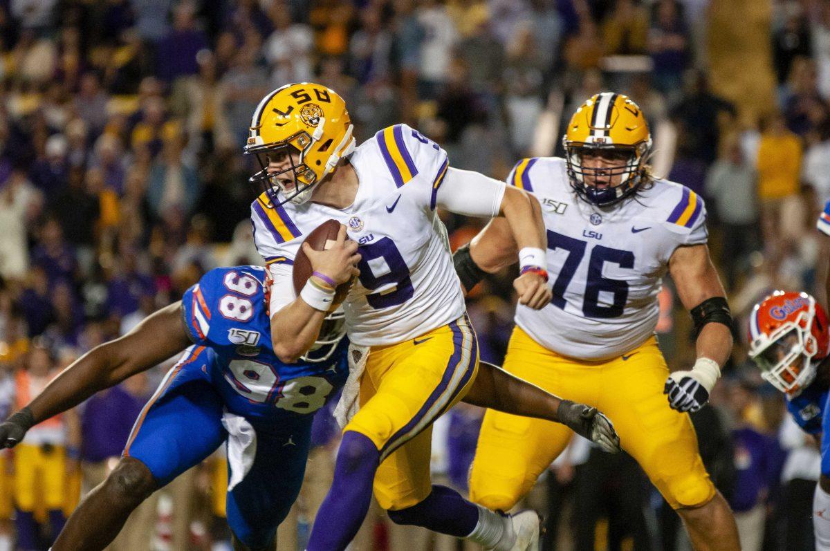 LSU senior quarterback Joe Burrow (9) runs the ball during the Tigers' 42-28 victory over Florida on Saturday, Oct. 12, 2019, at Tiger Stadium.