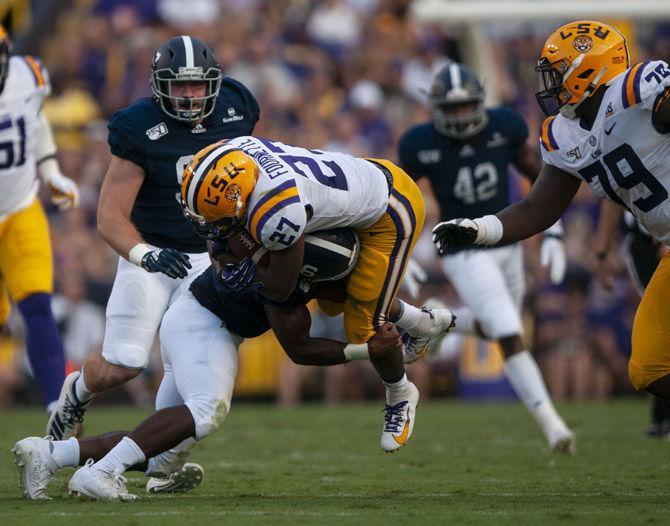 LSU senior running back Lanard Fournette (27) is tackled during the Tigers' 55-3 victory over Georgia Southern on Saturday, Aug. 31, 2019, at Tiger Stadium.