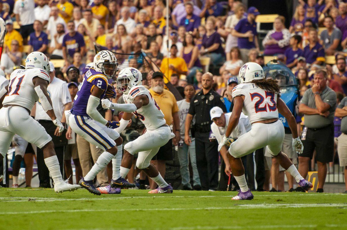 LSU junior wide receiver Justin Jefferson (02) sheds a defender during the Tigers' game against Northwestern State on Saturday, Sept. 14, 2019, in Tiger Stadium.