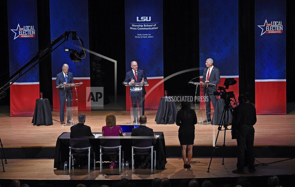 FILE - In this Sept. 19, 2019, file photo, from left, Eddie Rispone, Gov. John Bel Edwards and Republican Rep. Ralph Abraham participate in the first televised gubernatorial debate in Baton Rouge, La.