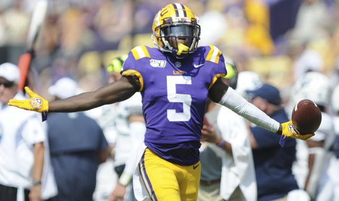 LSU junior cornerback Kary Vincent Jr. (05) celebrates after an interception during the Tigers' 46-6 victory over Utah State on Saturday, Oct. 5, 2019, at Tiger Stadium.