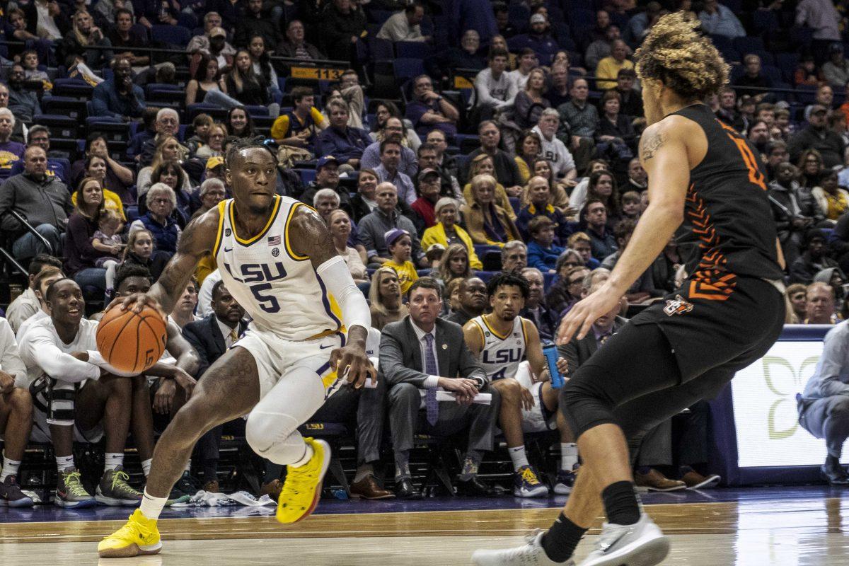 LSU sophomore forward Emmitt Williams (5) faces off against an opposing player during the Tigers' 88-79 victory against the Bowling Green Falcons on Friday, Nov. 8, 2019, in the PMAC.