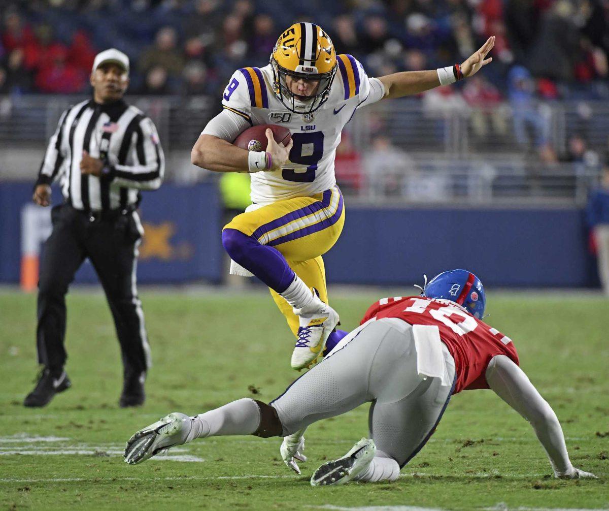 LSU quarterback Joe Burrow (9) avoids Mississippi linebacker Jacquez Jones (10) during the first half of an NCAA college football game in Oxford, Miss., Saturday, Nov. 16, 2019. (AP Photo/Thomas Graning)