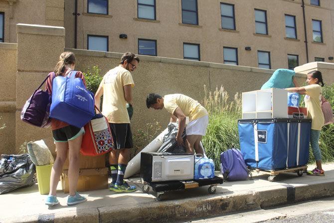 Move In Day, incoming students, Kalee, John, Nathan, Eliana, unload their belongings to move into their campus housing, on Wednesdsay, Aug, 17, 2016, in front of Annie Boyd Hall.