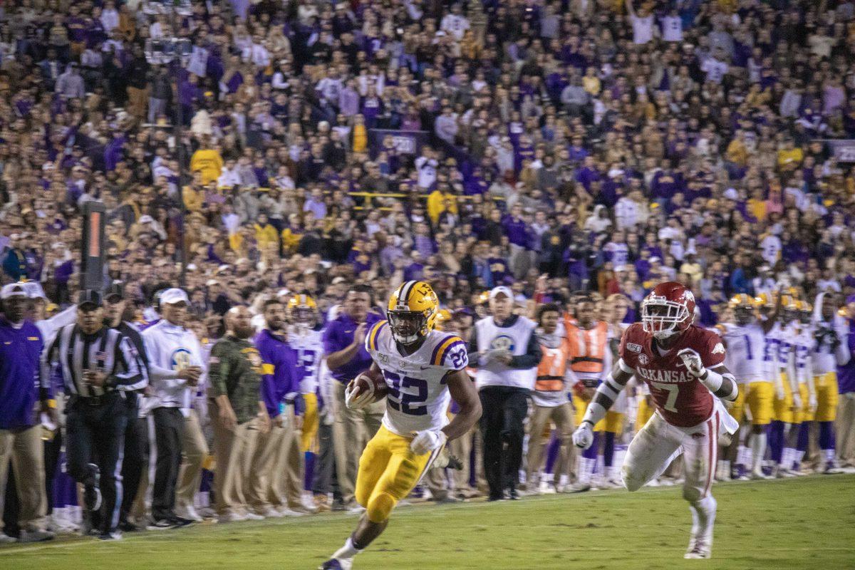 LSU junior running back Clyde Edwards-Helaire (22) runs the ball for a touchdown against Arkansas in Death Valley on Saturday, Nov. 23, 2019.