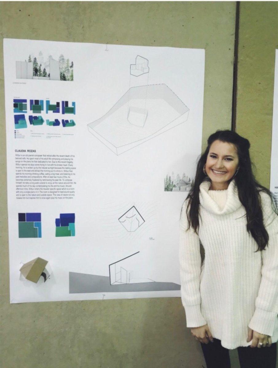 <p>Architecture junior Ellie Rozas stands by her final sophomore architecture project in April 2019.</p>