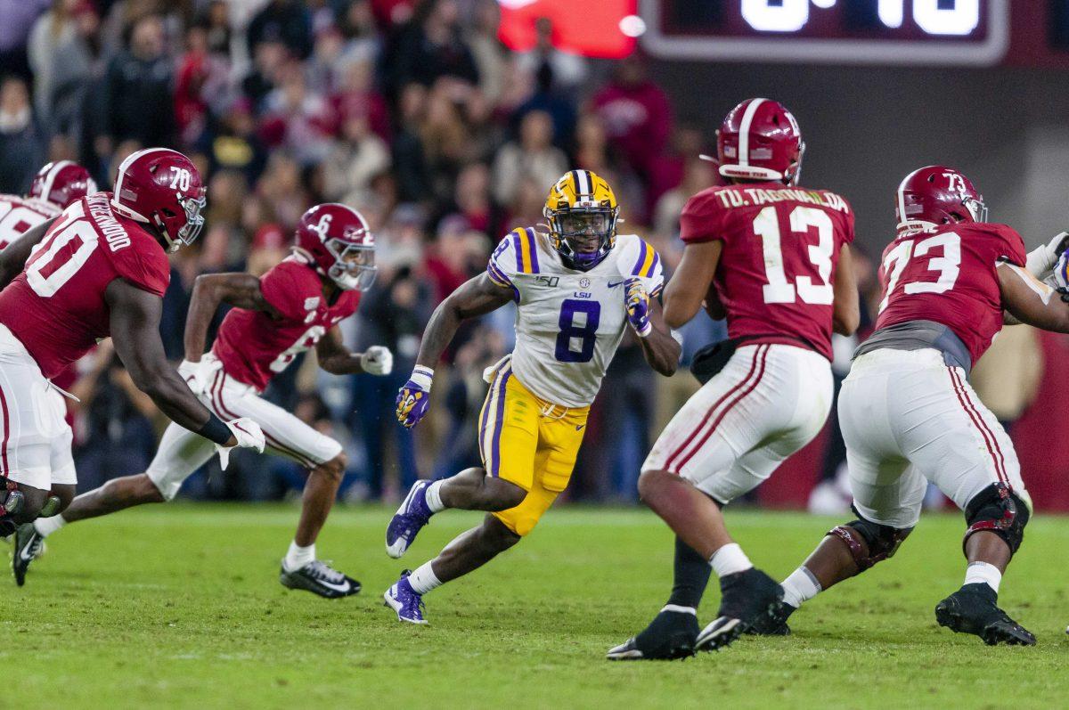 LSU junior linebacker Patrick Queen (8) chases after the Tua Tagovailoa (13) during the Tigers' 46-41 victory over Alabama in Bryant-Denny Stadium on Saturday, Nov. 9, 2019.