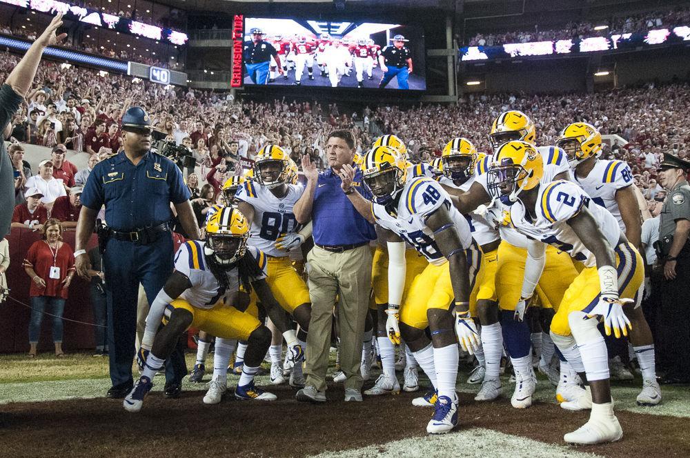 LSU head football coach Ed Orgeron leads the Tigers out of the tunnel before the Tigers' 24-10 loss against Alabama on Nov. 4, 2017, at Bryant-Denny Stadium.