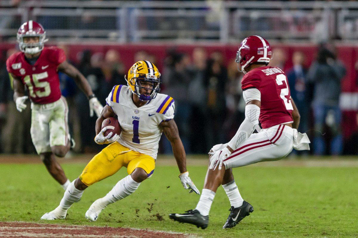 LSU sophomore wide receiver Ja'Marr Chase (1) runs the ball after a catch during the Tigers' 46-41 victory over Alabama in Bryant-Denny Stadium on Saturday, Nov. 9, 2019.